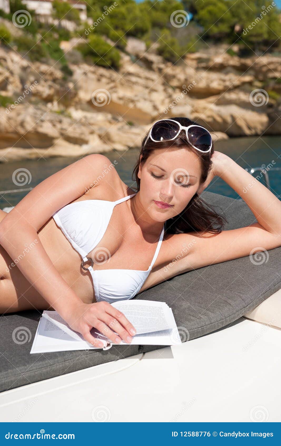 Attractive Woman Sunbathing On Luxury Boat Stock Photo 